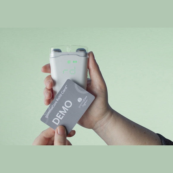 A person holding a device with a gammaCore Vagus Nerve 3-month Refill Card by ElectroCore in it.