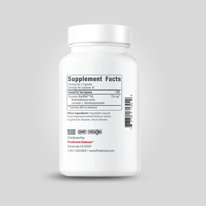 A white bottle of OHP Health Prodrome BDMC Curcumin (GTA) | 60 Capsules displays "Supplement Facts," highlighting curcuminoids and bisdemethoxycurcumin content, plus GMP and vegan logos, manufacturer info, and a barcode.